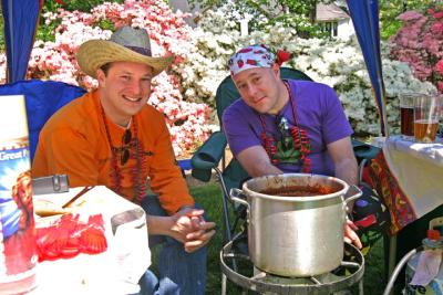 Fio and friend stand guard over their pot of chili