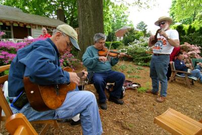 Chuck Popenoe (right) and fellow musicians play a tune