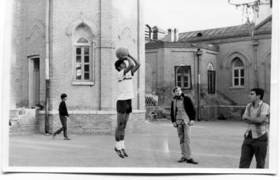 Shlomo Bakhash takes jumpshot while Jack Tawfik watches