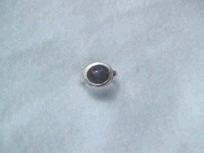The stone is a 10x12mm sodalite with a double bezel setting on a half-round band.