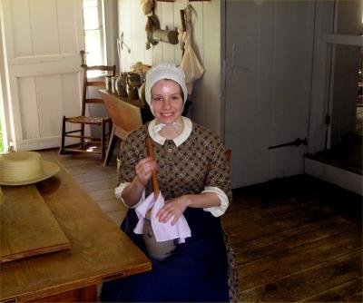 Butter churning at Old Bethpage Village