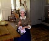 Butter churning at Old Bethpage Village