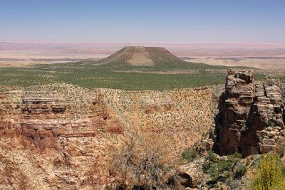View looking east from Desert View of the Painted Desert and a volcanic formation.