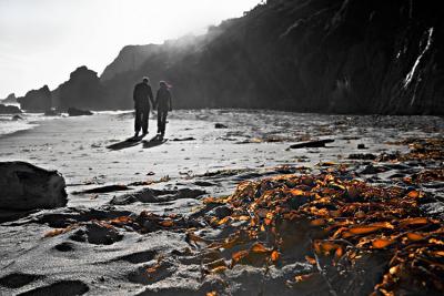 Beach couple with dried seaweeds (toned B&W)