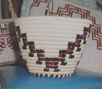 Imbricated Cowlitz basket. Variation of salmon-gill design.