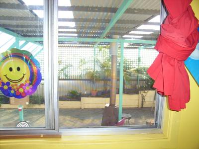 Looking out kayshas window to enclosed patio