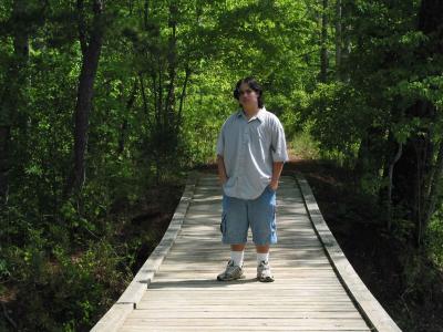 Frank on bridge over beaver pond