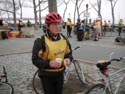 Deryk Harrison warms up with a BNY Marshal breakfast of coffee and a bagel. The BNY Marshal's day starts at 5:30AM at the Battery and can last for more than 12 hours.