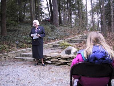 Janet Flick, expressing her appreciation of the garden, and sharing memories of her father. McKenzie Flick is in the foreground.