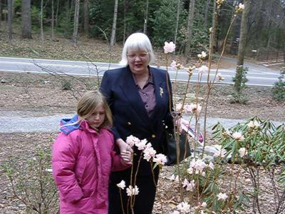 McKenzie and Janet Flick admiring the elepidote rhododendron 'McKenzie', named in her honor.