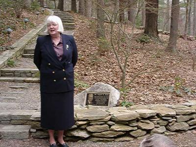 Janet Flick and the memorial plaque.