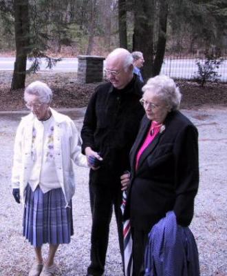 Mary Lou Kehr, Bill Klippel, Ethel Larus viewing the memorial plaque