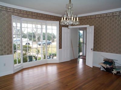This was the original formal dining room (photo taken during escrow). It is on the right side of the front door when standing outside. I decided to make it our family room since it was adjacent to the kitchen, to make it more accessible for getting food/drinks while watching T.V. since we eat 95% of our meals there, so this is now our family room. We replaced the original chandelier with a ceiling fan/light.