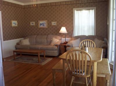 This is the same room after we moved in. I sit and watch traffic go by as I eat, while the rest of my family enjoys watching T.V. during mealtimes.