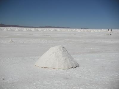 Locals scrape up salt into mounds