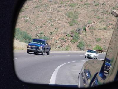 reflection of traffic approaching milepost 216 on the Beeline highway