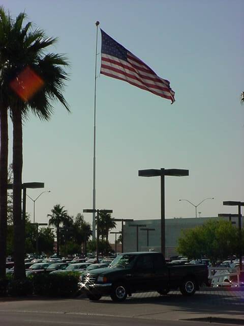 the green truck club under the giant flag at Berge Ford