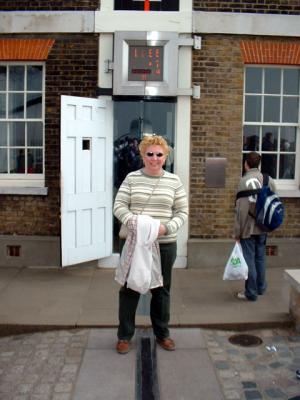Sue standing on the prime meridian