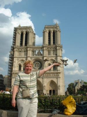 Sue feeding the birds infront of Notre Dame
