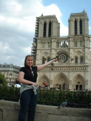 Nicki feeding the birds infront of Notre Dame