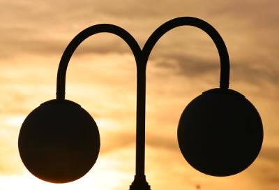 Silhouette of lamp at sunset