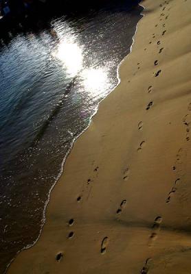 Sand with footsteps at Manly wharf