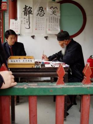 Man selling Calligraphy.