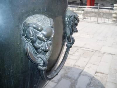 Details of a big bronze urn. These urns are placed around the palace and filled with water as a fire prevention measure. They are heated in winter to prevent the water from freezing.