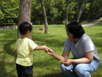 Mama, here's a beautiful flower for you.