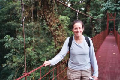 lisa holding up suspension bridge.JPG