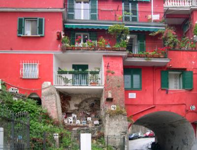 A red apartment with a wooden model of Amalfi. Model is historical showing Amalfi as it used to be.