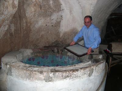 Pulverized cotton rags then put in vat of water. Cotton amalgamated with water and collected on a filter as seen here.