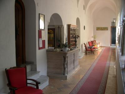 The front desk of the Hotel Luna Convento. The original (13th century) open air cloister is to the right.