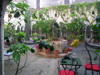The original 13th century hotel cloister, supposedly founded by St. Francis of Assisi. Now a place to have a glass of wine.