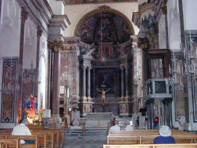 The nave and high alter of the Duomo. Baroque style. Wooden crucifix from the 13th cent. and paintings from the 18th cent.