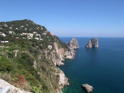 View of south shore of Capri from the terrace of Augustus' Gardens, showing the often photographed Faraglioni Rocks.