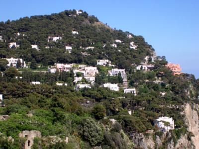Mountain on south shore. Sophia Loren's house in middle with columns. Price for two room flat at least 500,000 euros.