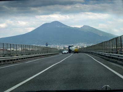 Approaching Naples. Background: Mt. Vesuvius - Only active volcano in Europe. Its eruption buried Pompeii in 79 a.d.