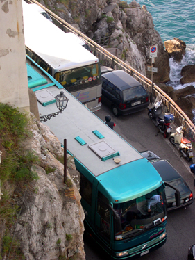 Typical traffic on the Amalfi Coast. A few inches often separate buses. Telephoto setting from our patio.