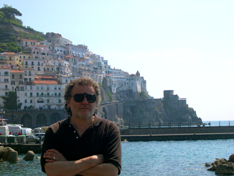 Richard waiting on a pier in Amalfi for the boat to the Emerald Grotto. Our hotel is seen at the top of hill in the background.