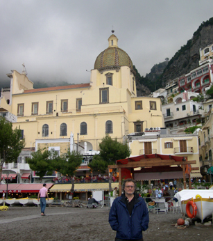 Richard on the beach in Positano. The Church of St. Maria Assunta with its tiled, majolica dome is in the background.