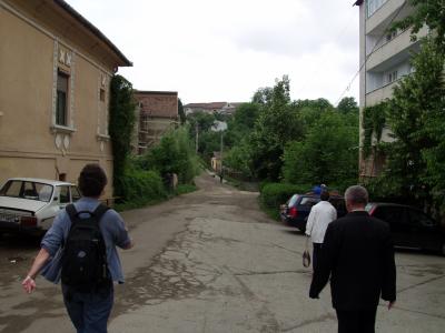 The priest (right) leading to Frank's house