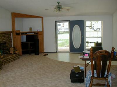 living room - entertainment center & front entry