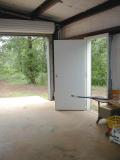 veiw from inside garage, outside man door open & door #2