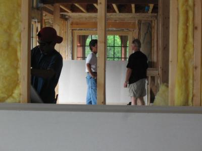 Gus talking with the foreman, for lack of a better word