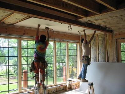 The dining room gets its drywall (there are 4 teams of guys working)