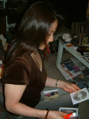 Preparing a CD with photos for her mom in Japan