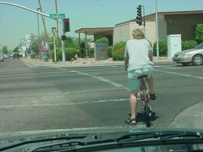 waiting to cross the street on a green light