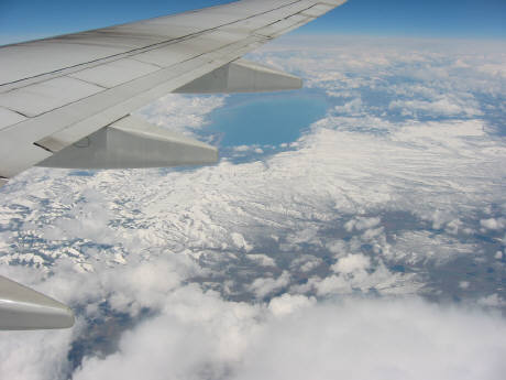 flight from Chicago to San Francisco looking down at snow on the mountains