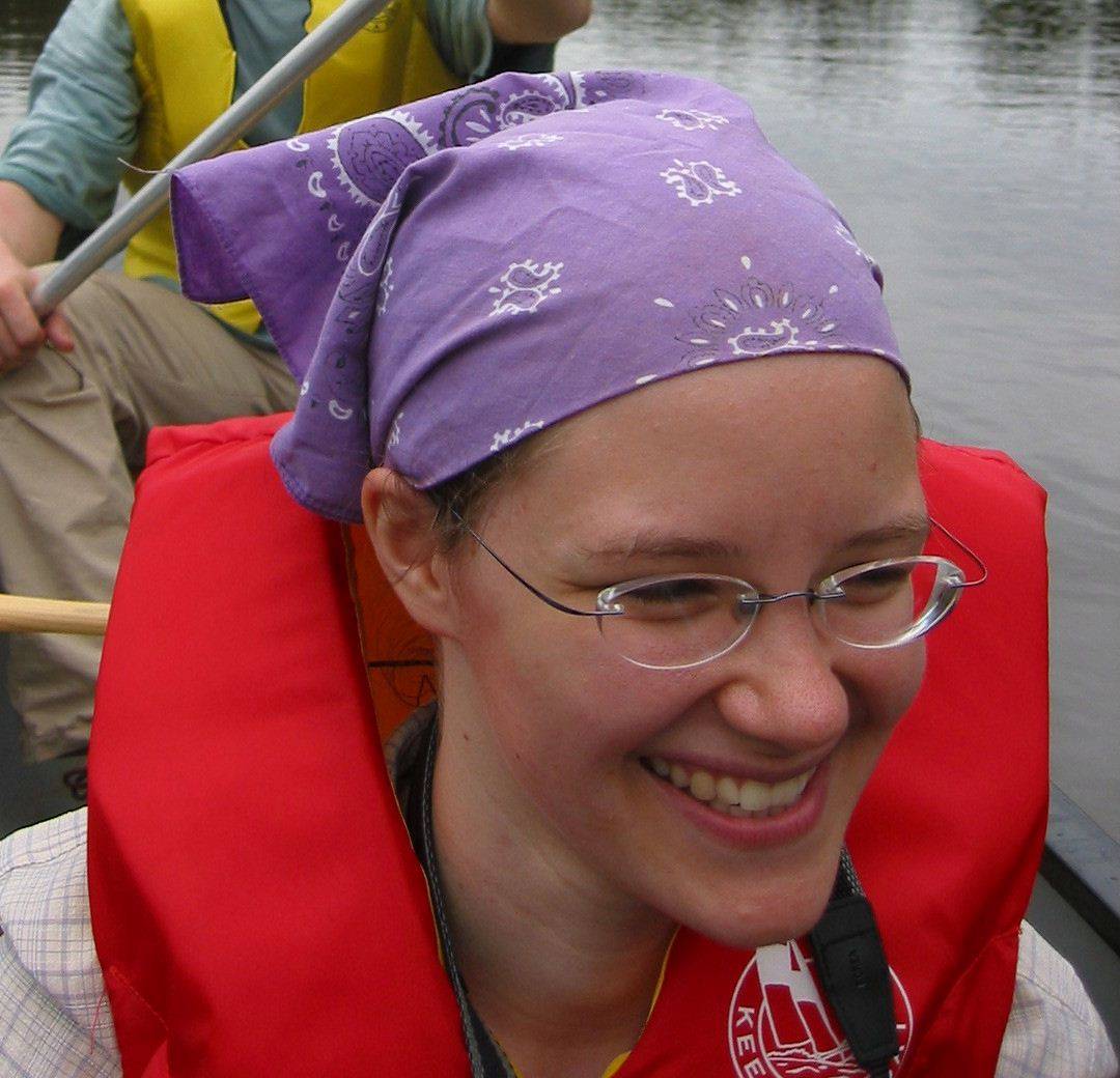 Janet in Canadian dress in a canoe on the Nyong River south of Mbalmayo